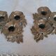 Pair of antique three-branch candlesticks with a floral design.