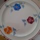 8 flat plates of the years 60 in faience Hammage. Moulins des Loups.