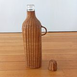 Bottle, old carafe in glass and wicker, 1950s