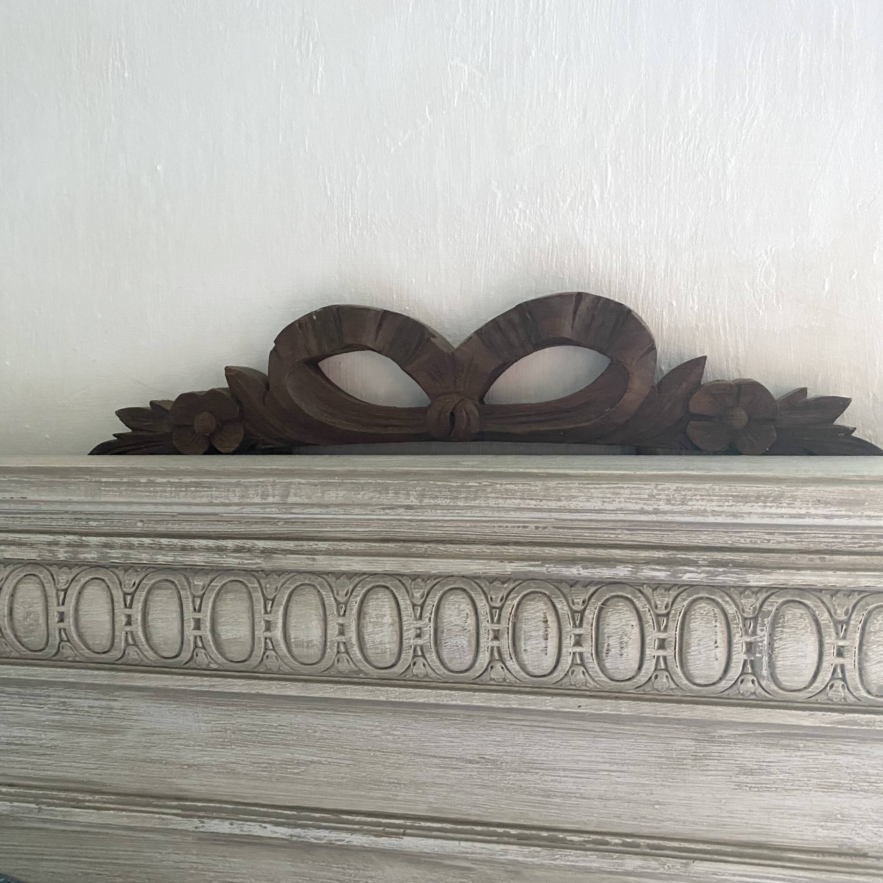 Antique carved wooden ribbon pediment