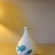 White ceramic with dolphin motif