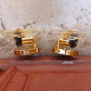 Pair of wall sconces in crystal glass and gilded brass. Venini style.
