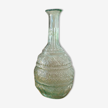 Large blown green glass decanter and relief decoration