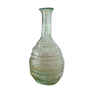 Large blown green glass decanter and relief decoration