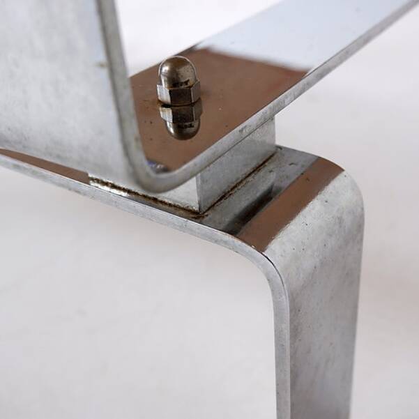 Acid-etched brass coffee table top by Christian Krekels with an agate stone