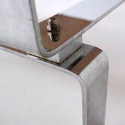 Acid-etched brass coffee table top by Christian Krekels with an agate stone