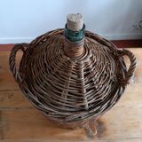 Dame Jeanne in her wicker and rattan clothing