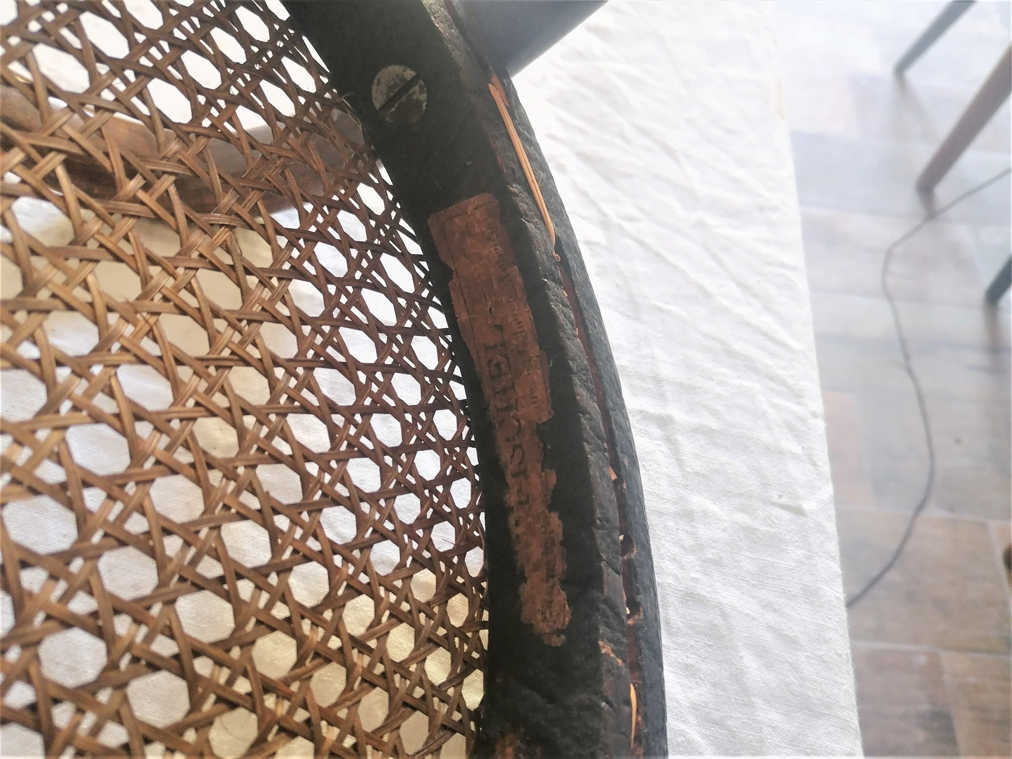 Old children's armchair in curved wood. Fischel