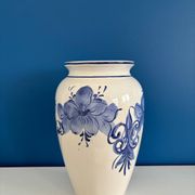 Vintage white and blue ceramic vase with floral pattern