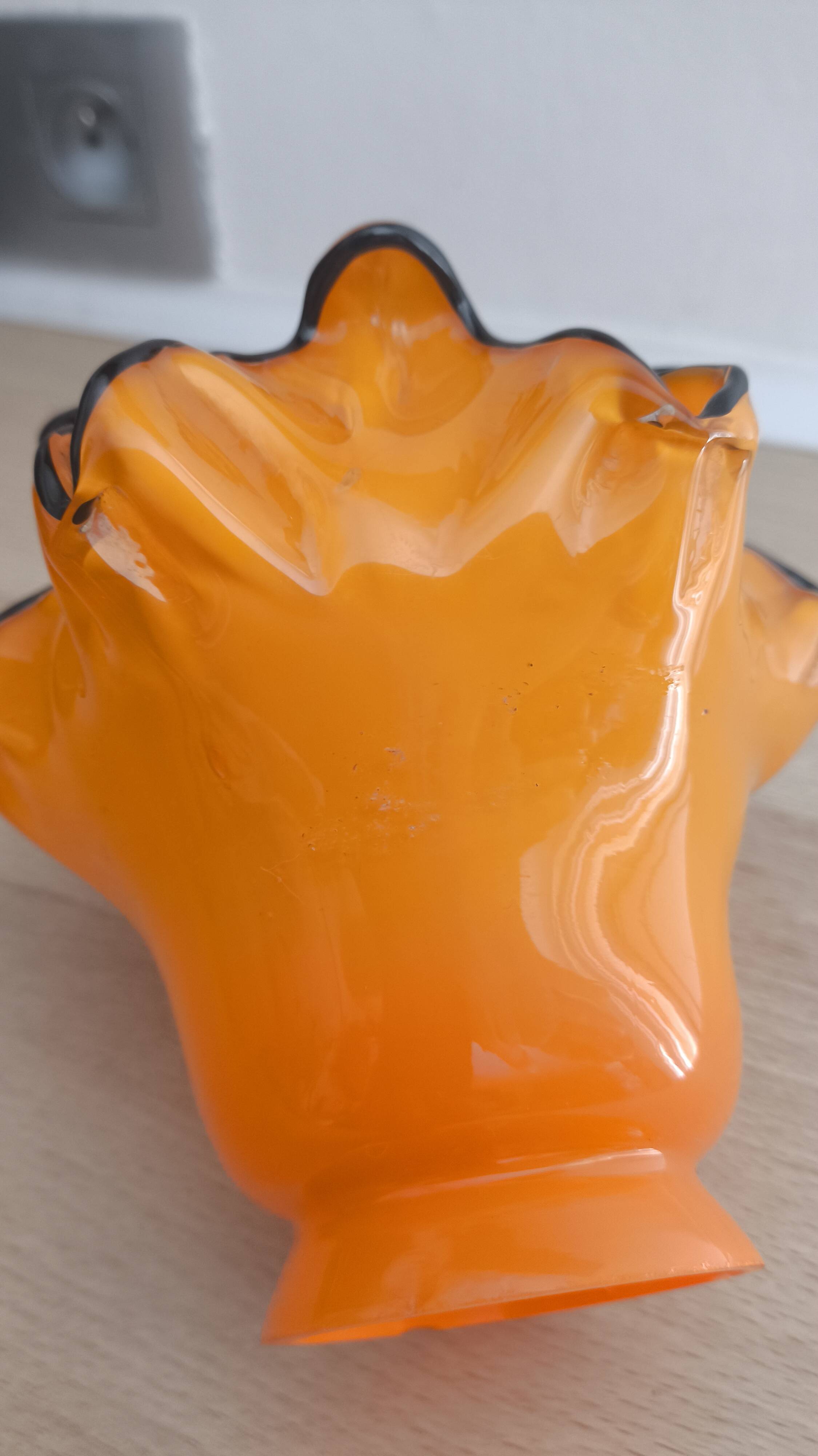 Pair of orange glass tulips with black trim, vintage 70s.