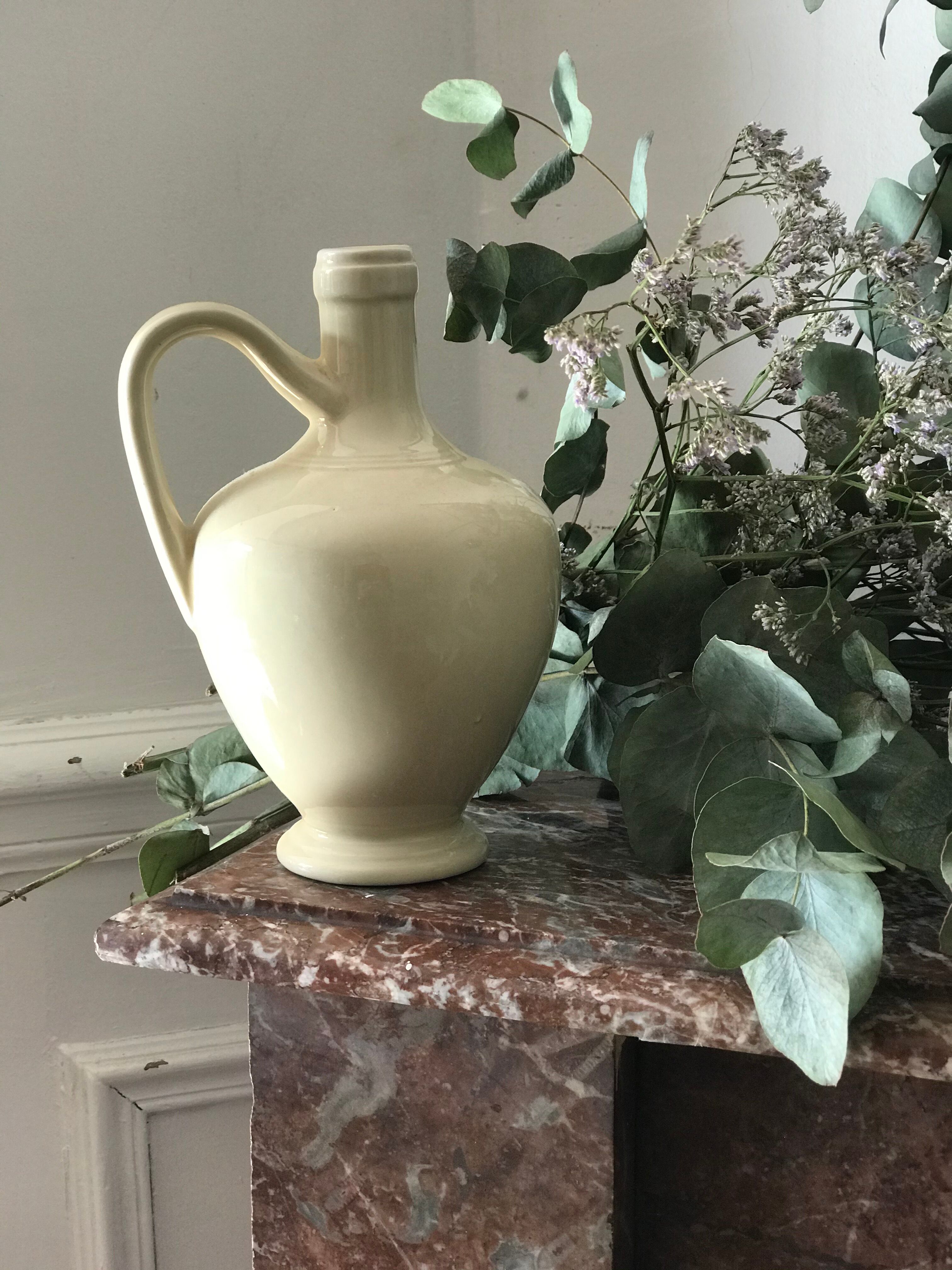 Pitcher with ceramic handle