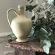 Pitcher with ceramic handle