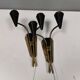 A set of wall lamps in black lacquered metal with brass details