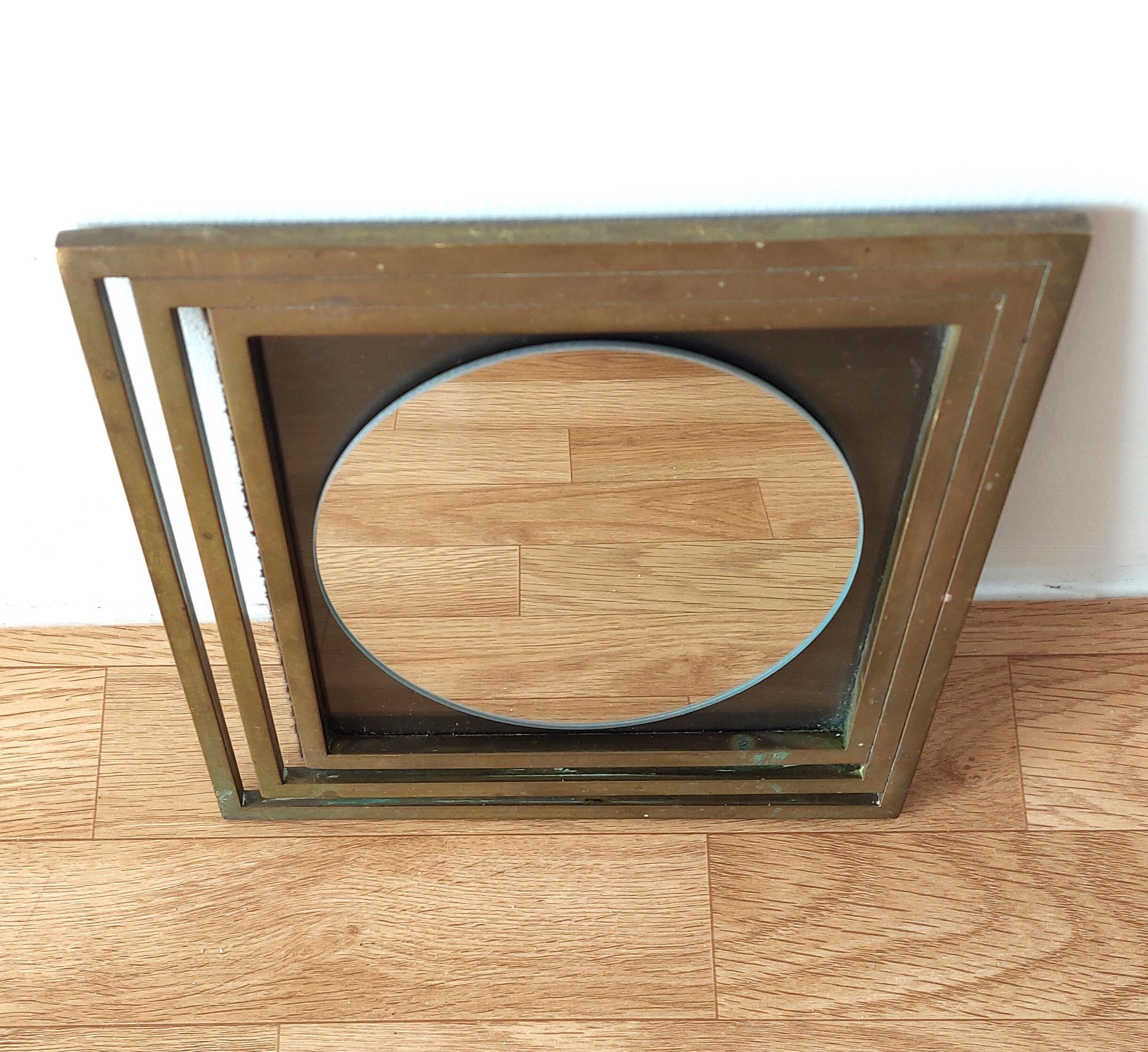 Modernist mirror in gilded brass 1960.