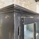 Display cabinet in patinated wood