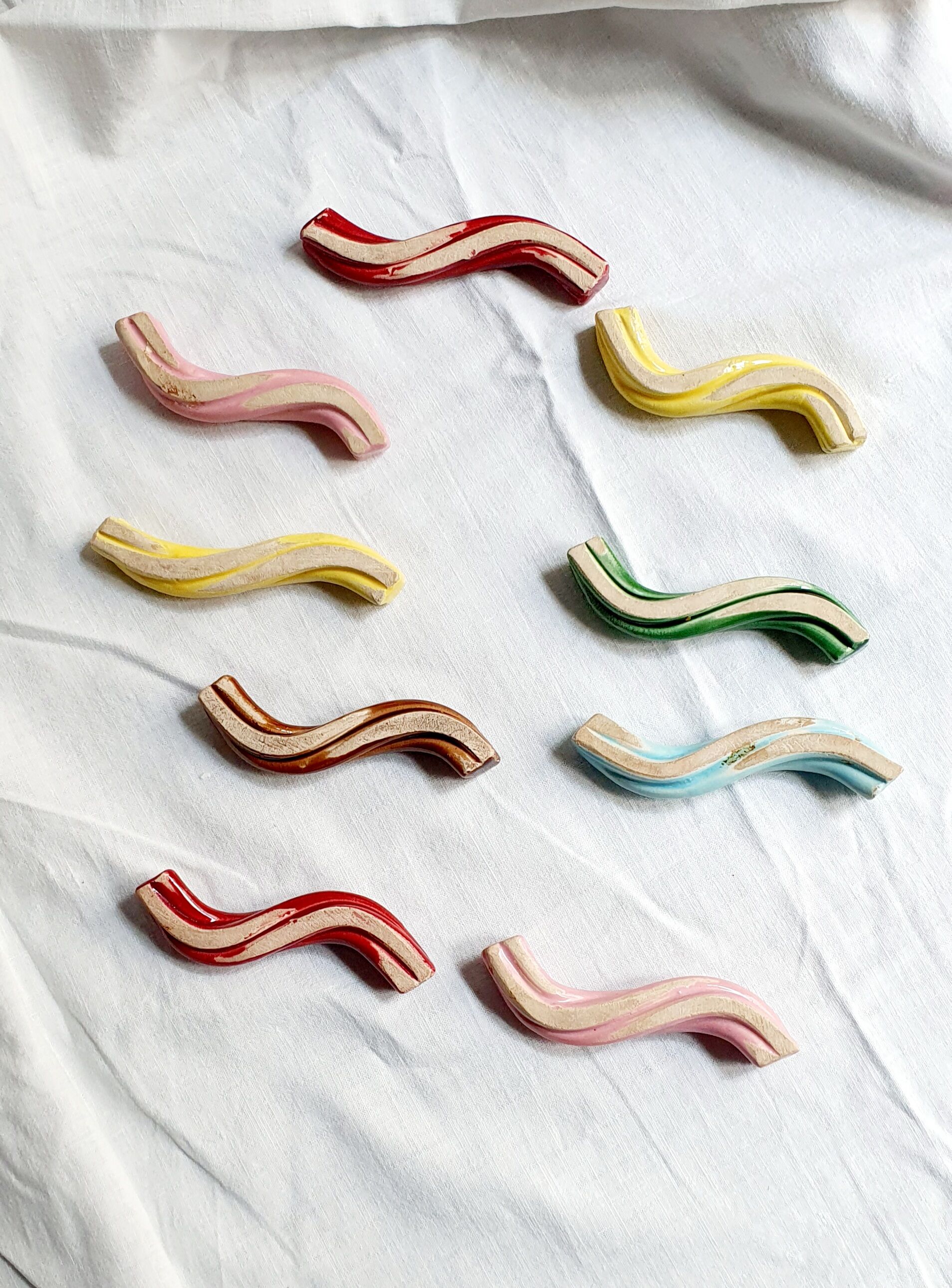 Set of 9 enamelled ceramic knife holders