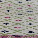Handmade geometric patterned rug in natural wool