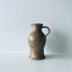 Pitcher in sandstone pyrity signed