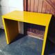 Small yellow metal desk