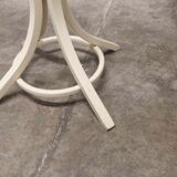 Parrot wears white Baumann coat 1970