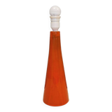 Ceramic table lamp with partial orange glaze.