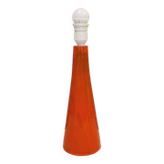 Ceramic table lamp with partial orange glaze.