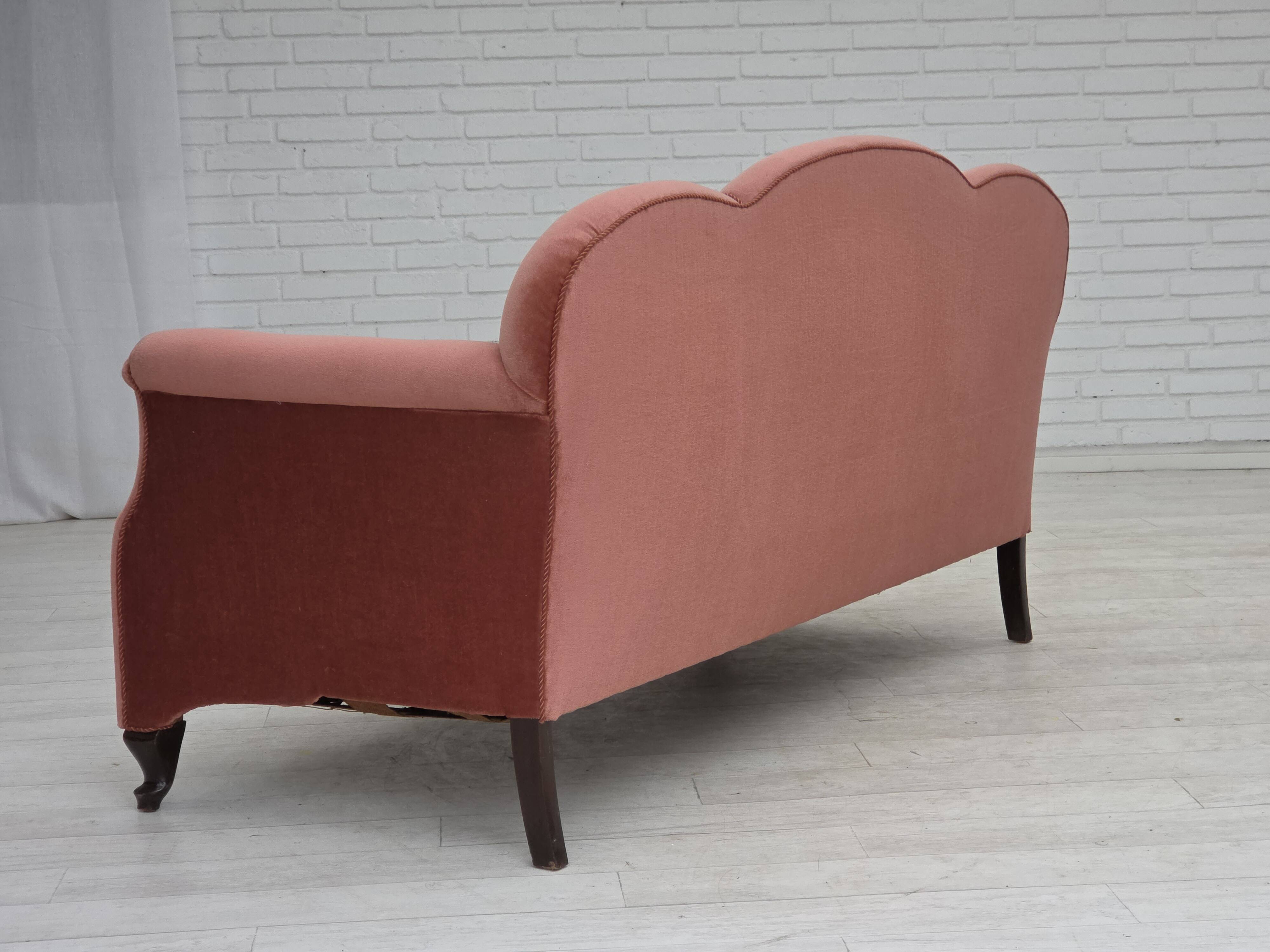 1950s, Danish 2-seater sofa, salmon pink furniture velour, oak wood legs.
