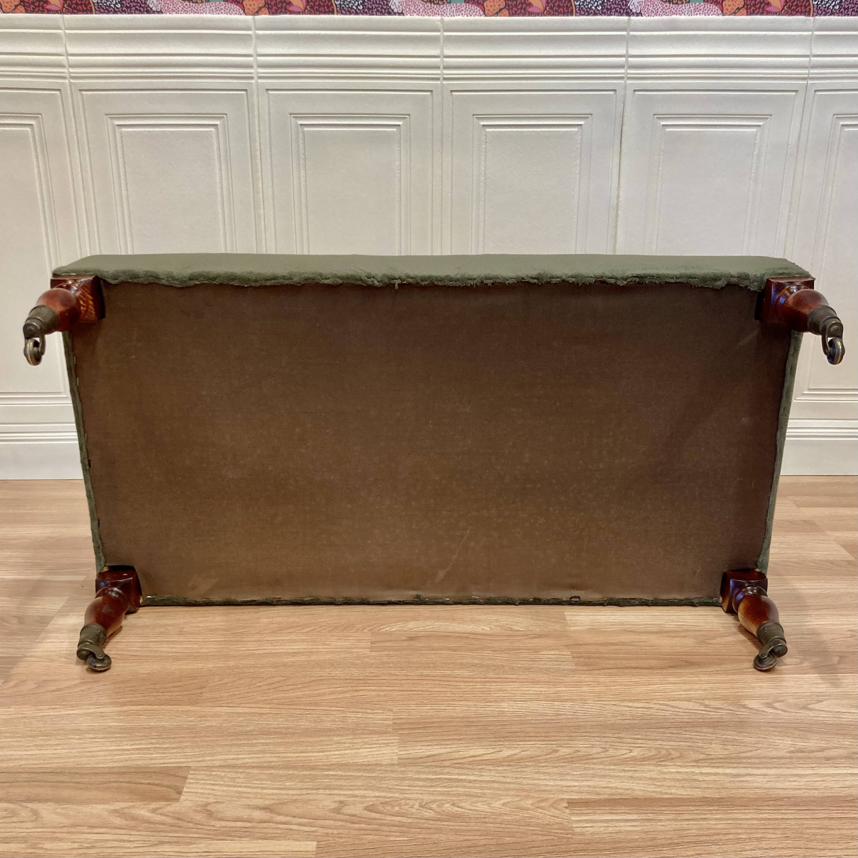 Khaki and oak sofa on casters, 1950s design.