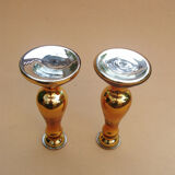 Pair of equalized candle holders with silvering, mixed gilding