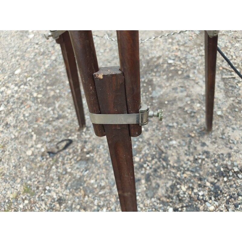 Spotlight on wooden and chrome tripod.