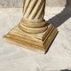 Wooden column in Corinthian style with gilding.