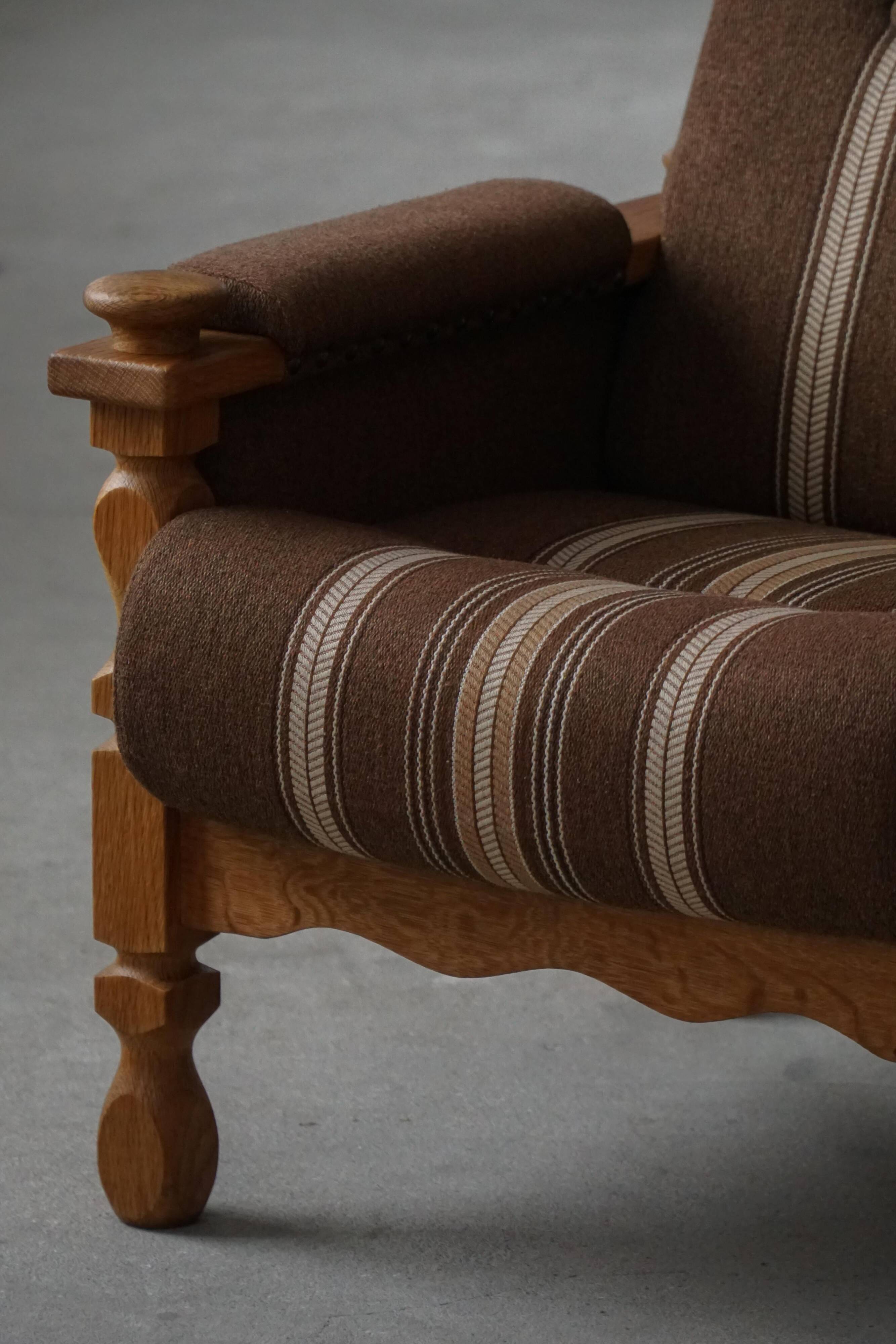 Modern Danish, a pair of lounge chairs in oak and wool, Henning Kjærnulf, 1960s.