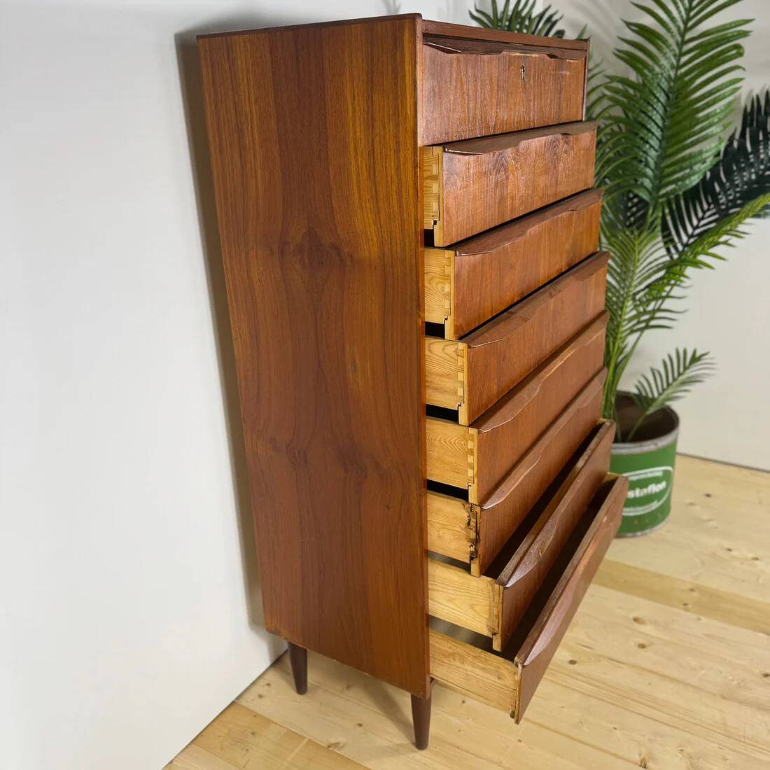 Mid-century Danish high chest of drawers with eight teak drawers.