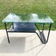 Metal and glass coffee table with magazine rack by Roche Bobois from the 1950s.