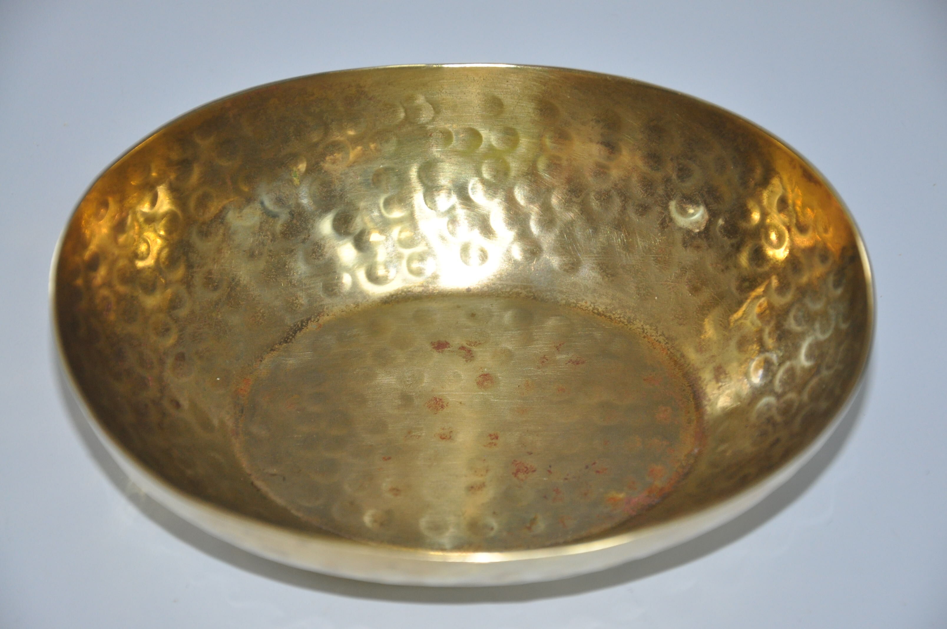 Empty hammered brass pocket
