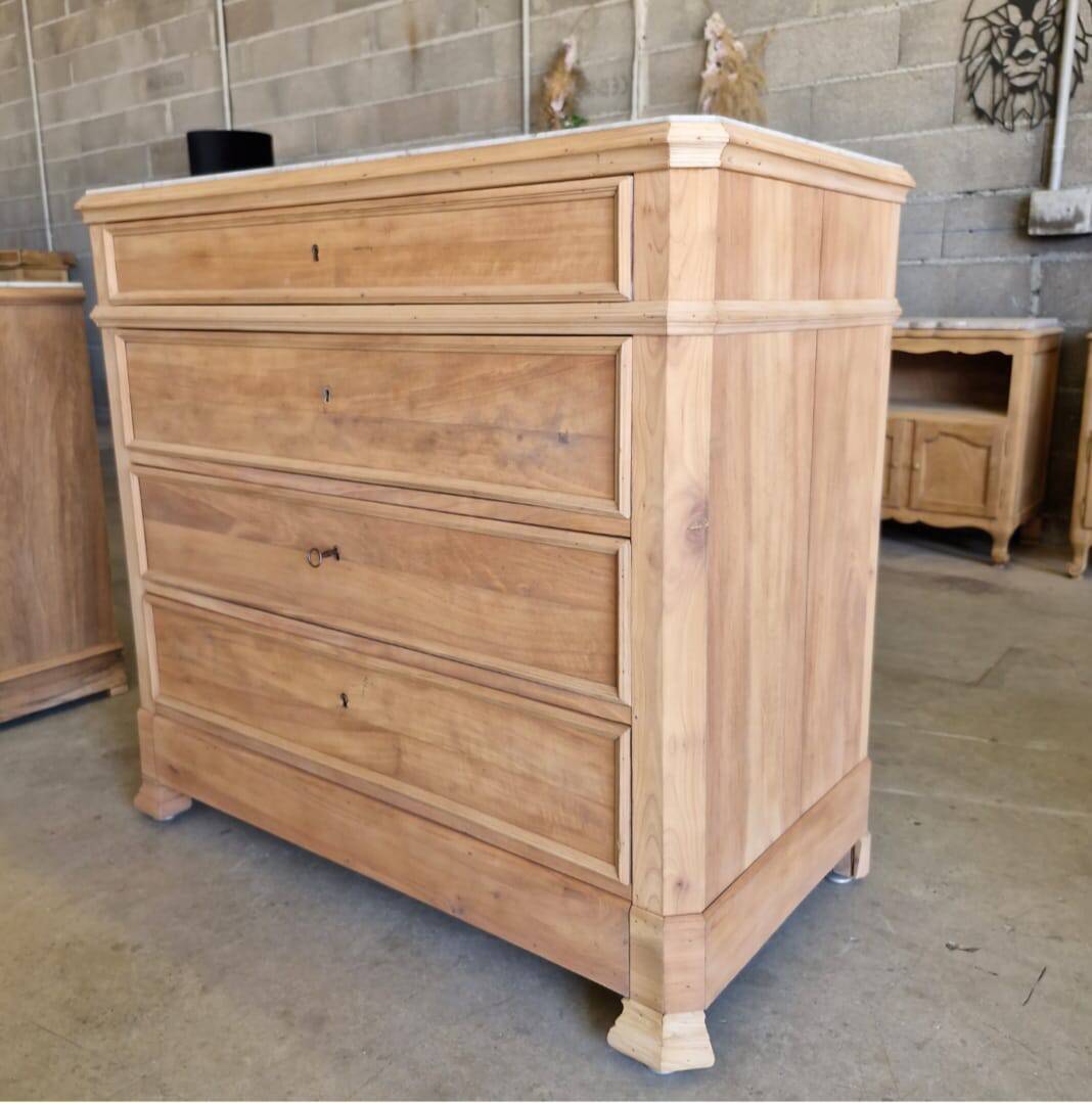 Walnut chest of drawers with white marble.