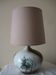 Glazed ceramic ball lamp signed Bossis with a fabric shade.
