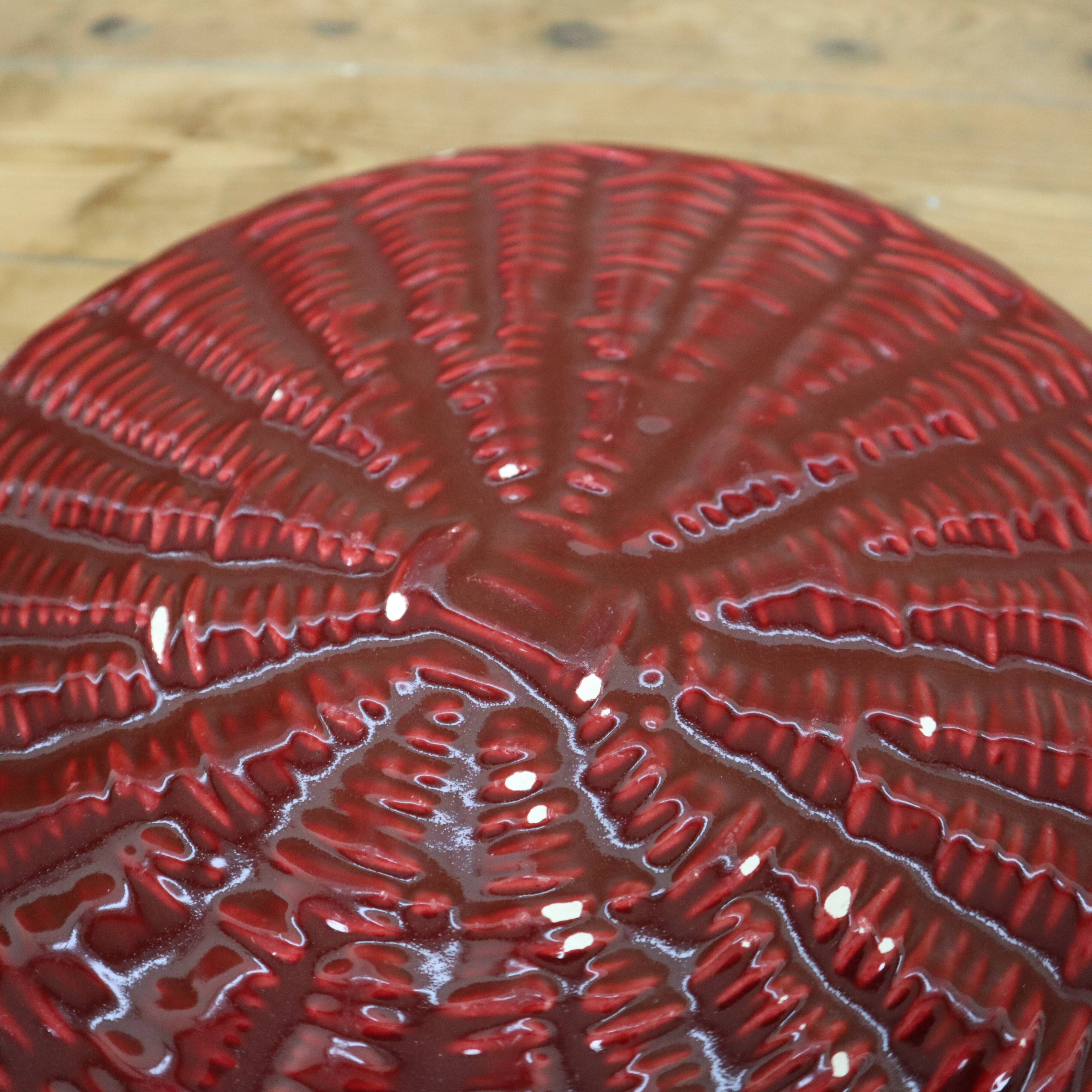 Burgundy slip tray and its small vintage knife from the 50s