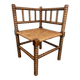 Old armchair, corner chair, made of wood and straw