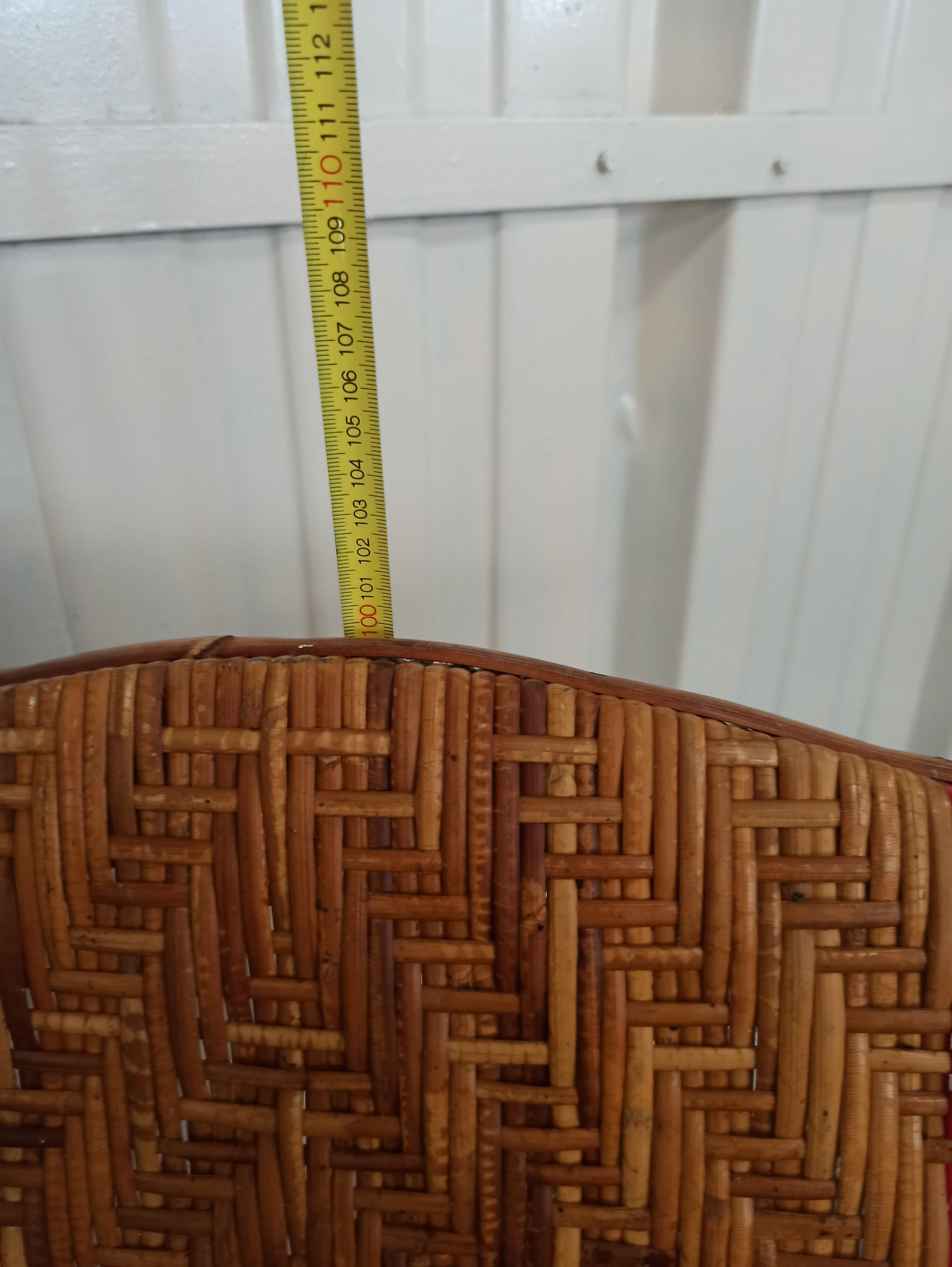 Sunbathing sunbathing in wicker rattan wood deckchair red lounger
