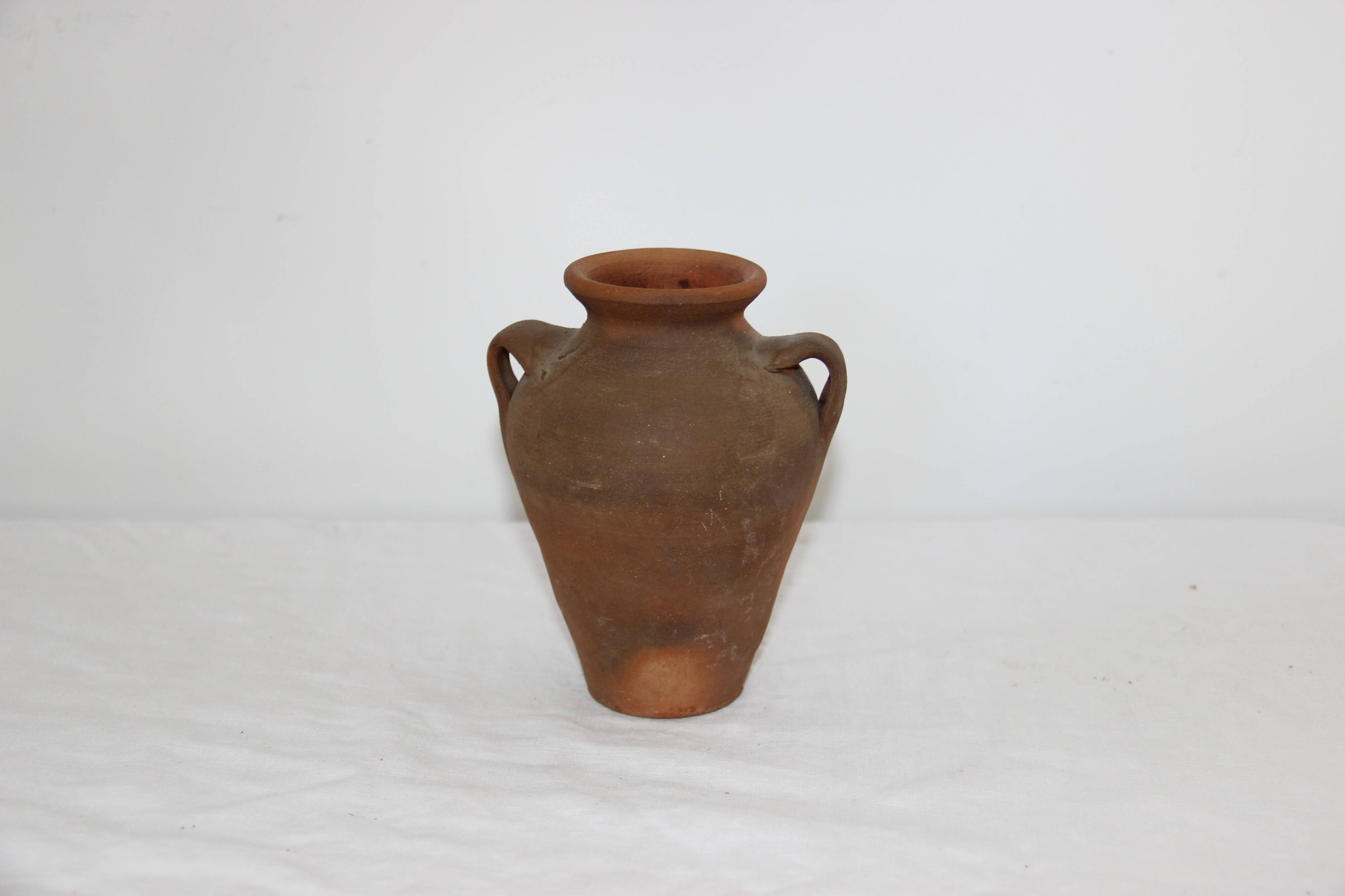 Old little terracotta jar