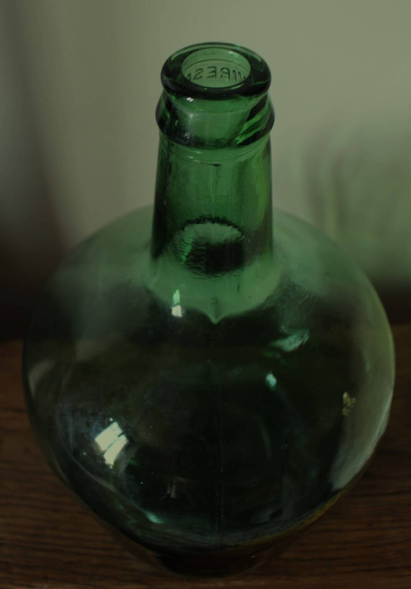 Dame Jeanne carboy from the Viresa collection in dark green glass