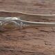 Silver-plated metal lion's paw sugar tongs