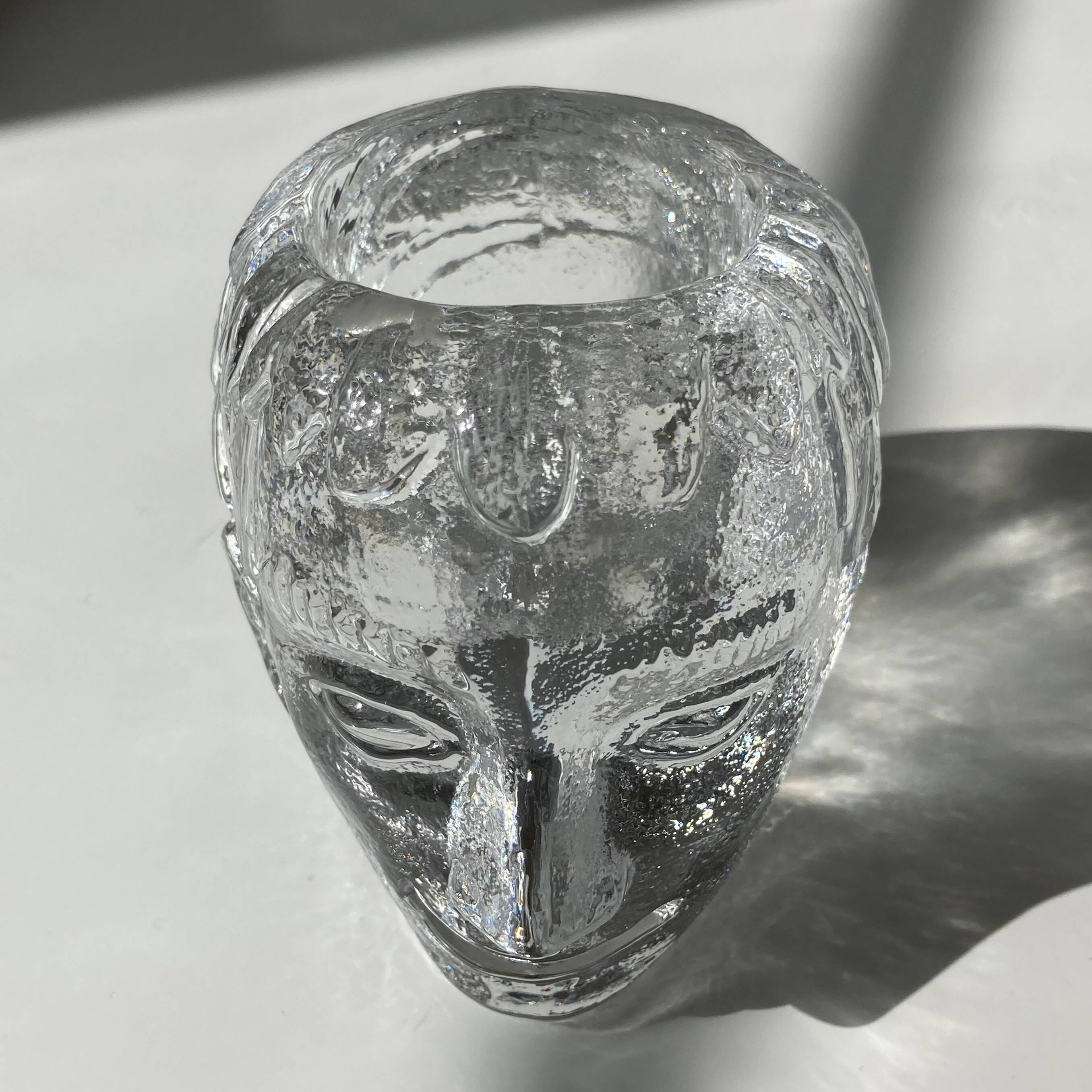 Glass candlestick by Bertil Vallien for Kosta Boda, man's head.