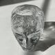 Glass candlestick by Bertil Vallien for Kosta Boda, man's head.