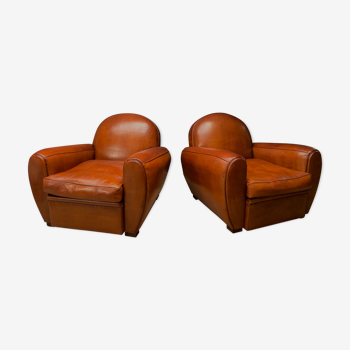 Pair of french leather club chairs, havana round-back models c1950's