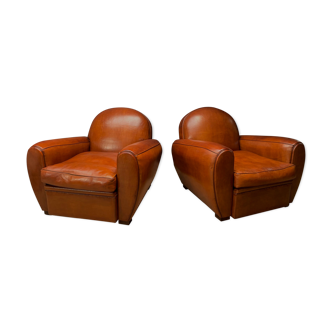 Pair of french leather club chairs, havana round-back models c1950's