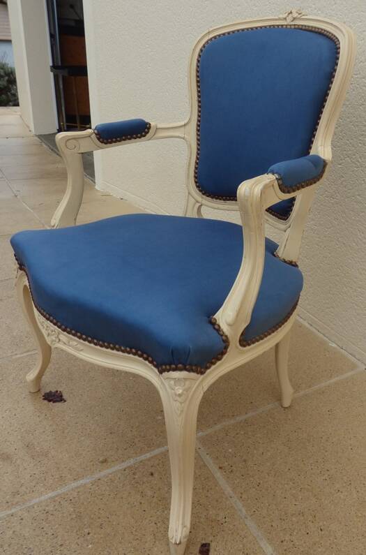 Cabriolet armchair in lacquered wood trimmed in blue satin, Louis XV style