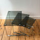 Nest of coffee tables in chrome with smoked glass top.