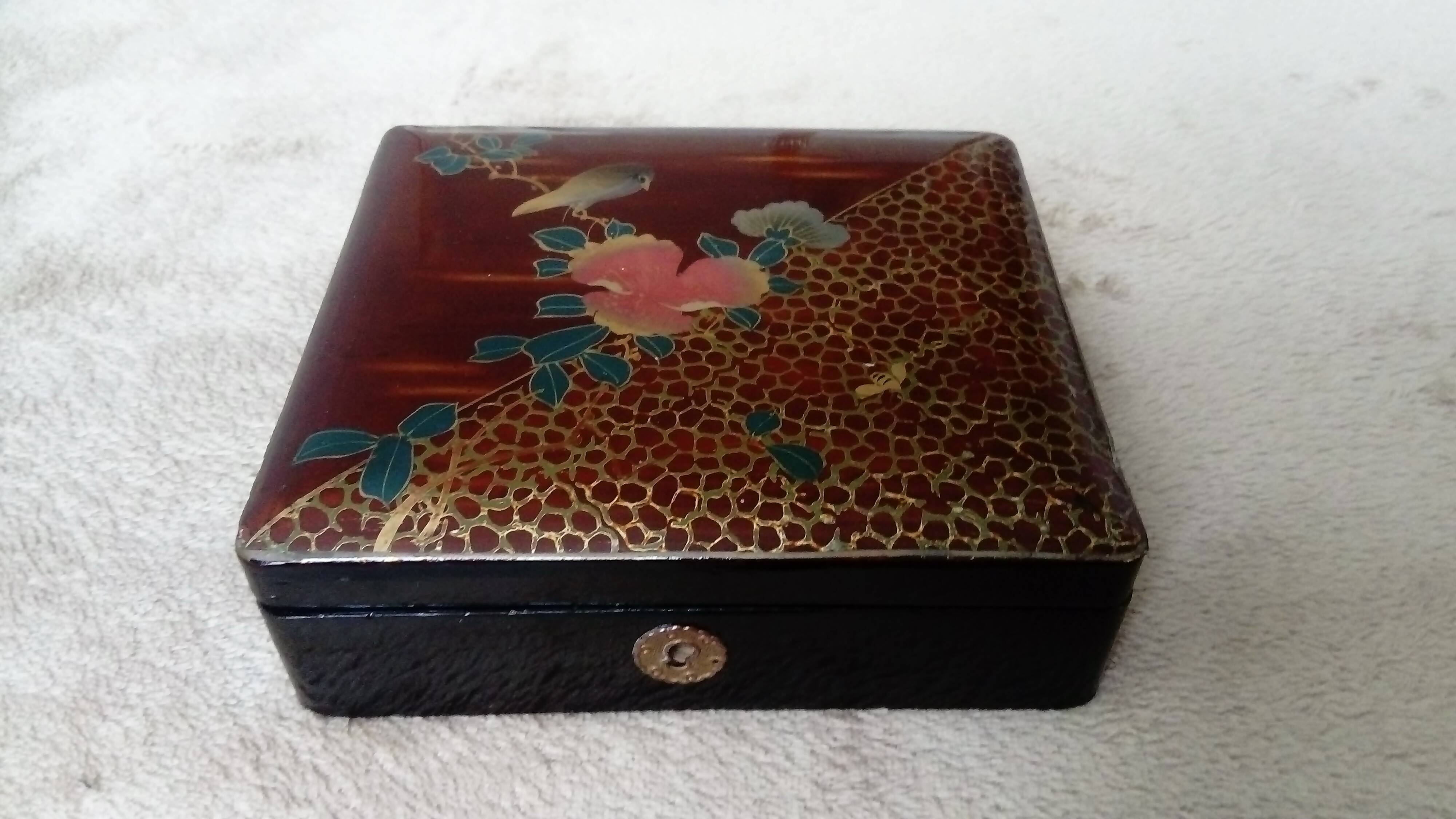 Old lacquered jewelry box with Asian decoration bird, flower, bee